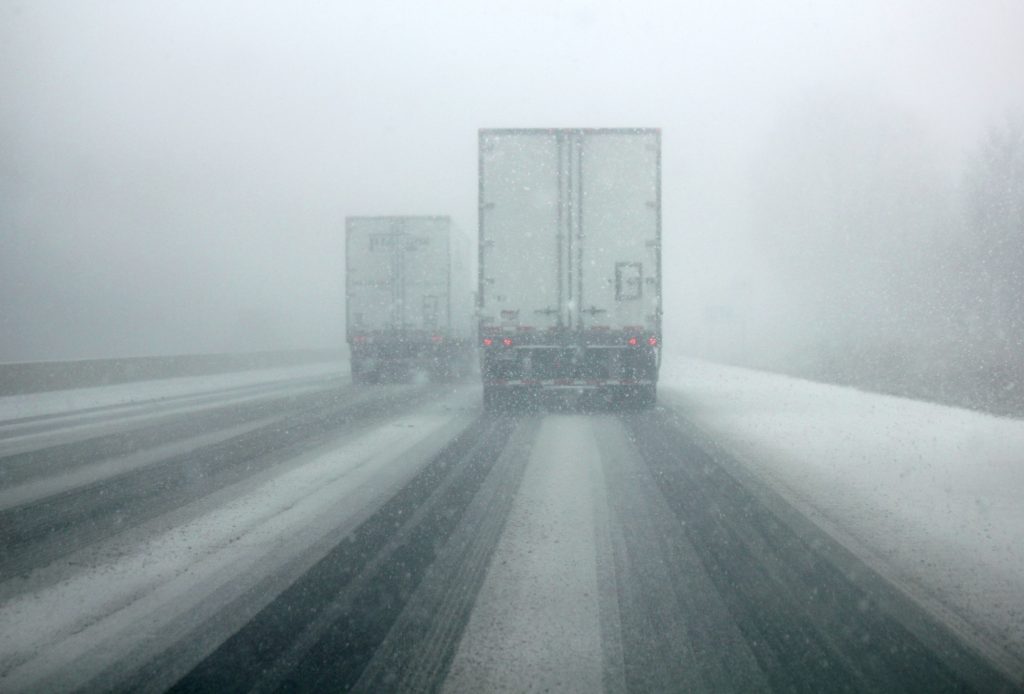 Keep on trucking! Trucks transporting goods on dangerous winter roads